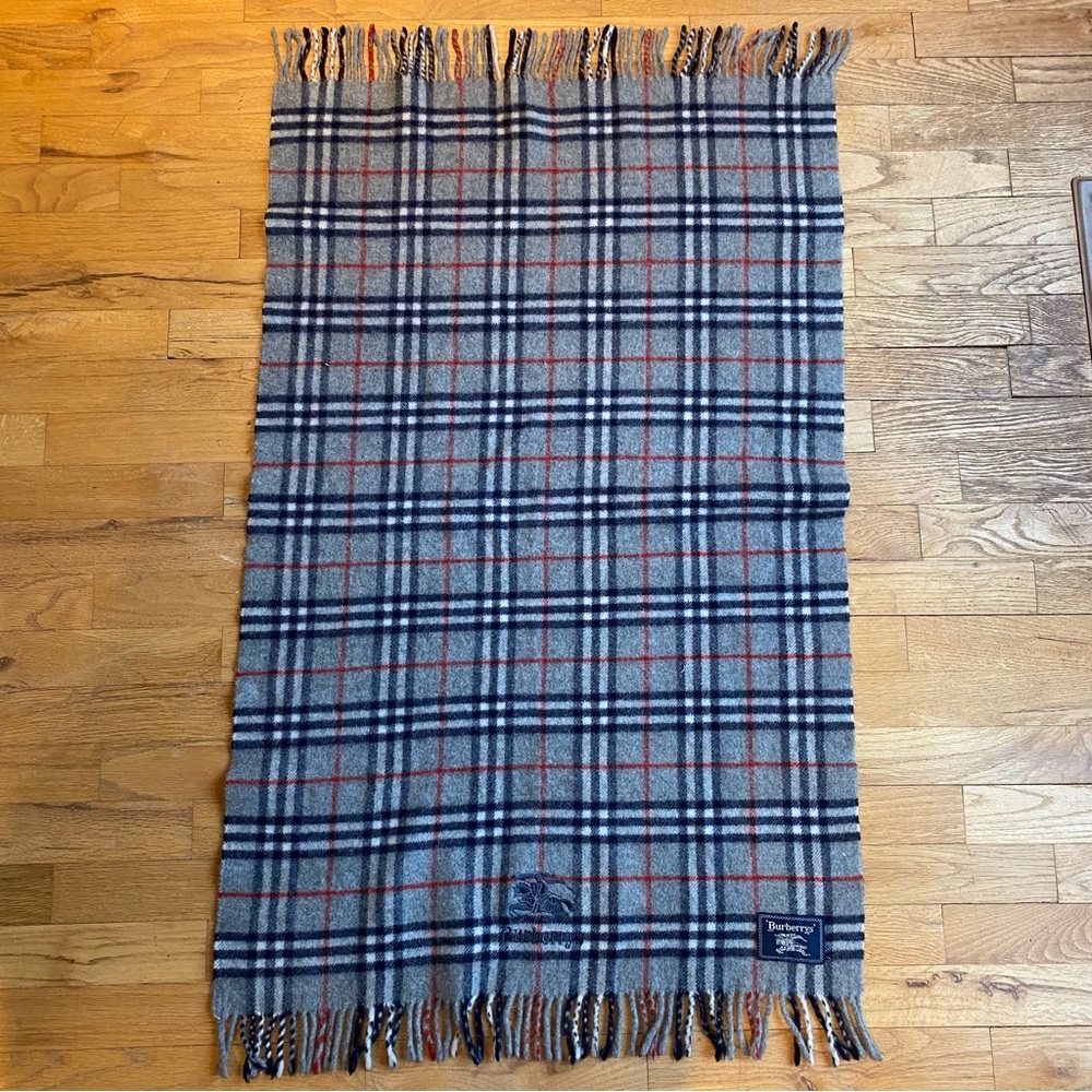 Burberry’s lap blanket/scarf Grey/navy new wool with fringe. 40” by 25”